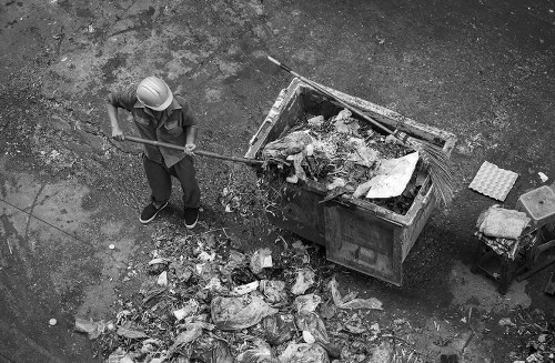 Business professionals managing waste removal in Brockley office
